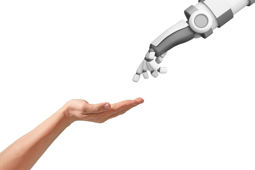 Image of a human hand and a robot hand.